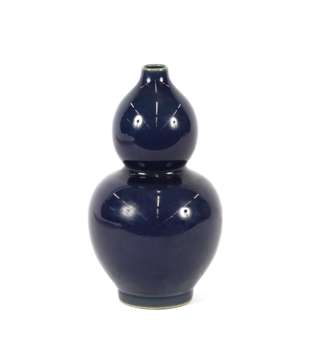 A Chinese porcelain blue double gourd shaped vase