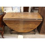 An Antique oak gate leg dining table, raised on baluster supports, fitted single drawer, 118cm