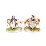 A pair of 19th Century Staffordshire cow groups, 16.5cm long x 18cm high
