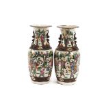 A pair of 19th Century Chinese baluster vases, decorated in coloured enamels with scenes of warriors