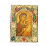 A printed Icon of Madonna and Child, in decorative enamel frame, 14cm x 10cm overall