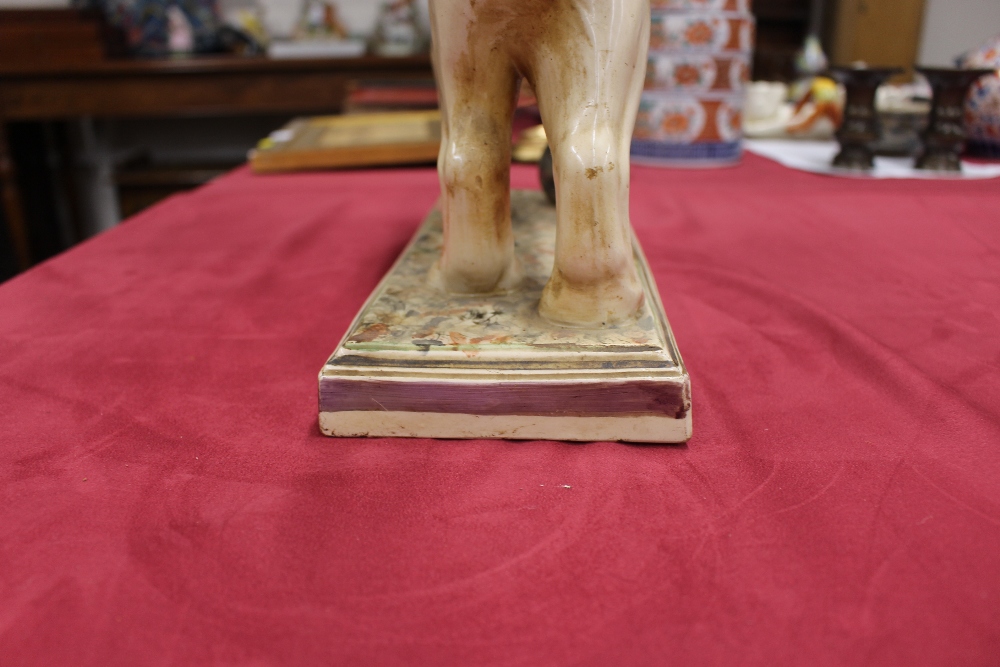 A 19th Century Staffordshire lion figure, right paw resting on a ball, 34cm long - Image 9 of 14