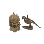 A 19th Century Indian bronze lamp, in the form of a Falcon, 13cm high; and a 19th Century bronze oil