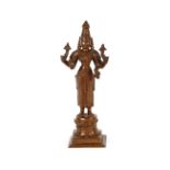 A bronze multi armed figure of Shiva, raised on a square base, 25cm high