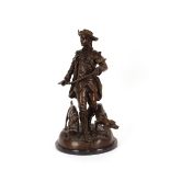 A bronze figure group, depicting a hunter and dog, raised on circular faux marble plinth, 55cm high