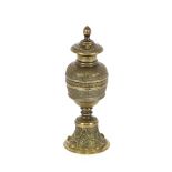 A 19th Century lacquered brass baluster Sander, with lozenge and spiral decoration on stiff lily