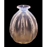 A Sabino iridescent glass baluster vase, with foliate and fruit ribbed decoration, 23cm