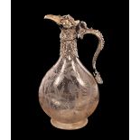 A Victorian etched glass and silver mounted claret jug, the body having leaf and butterfly