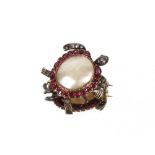 A blister pearl, ruby and white stone set tortoise brooch