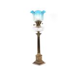 A plated Corinthian column oil lamp, having hob-nail cut reservoir and etched blue tinted shade,