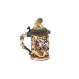 A rare 18th Century Capo di Monte silver mounted lidded tankard, decorated lion surmount and