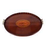 A fine quality late 19th Century mahogany oval tea tray, with central conch shell inlay, flanked