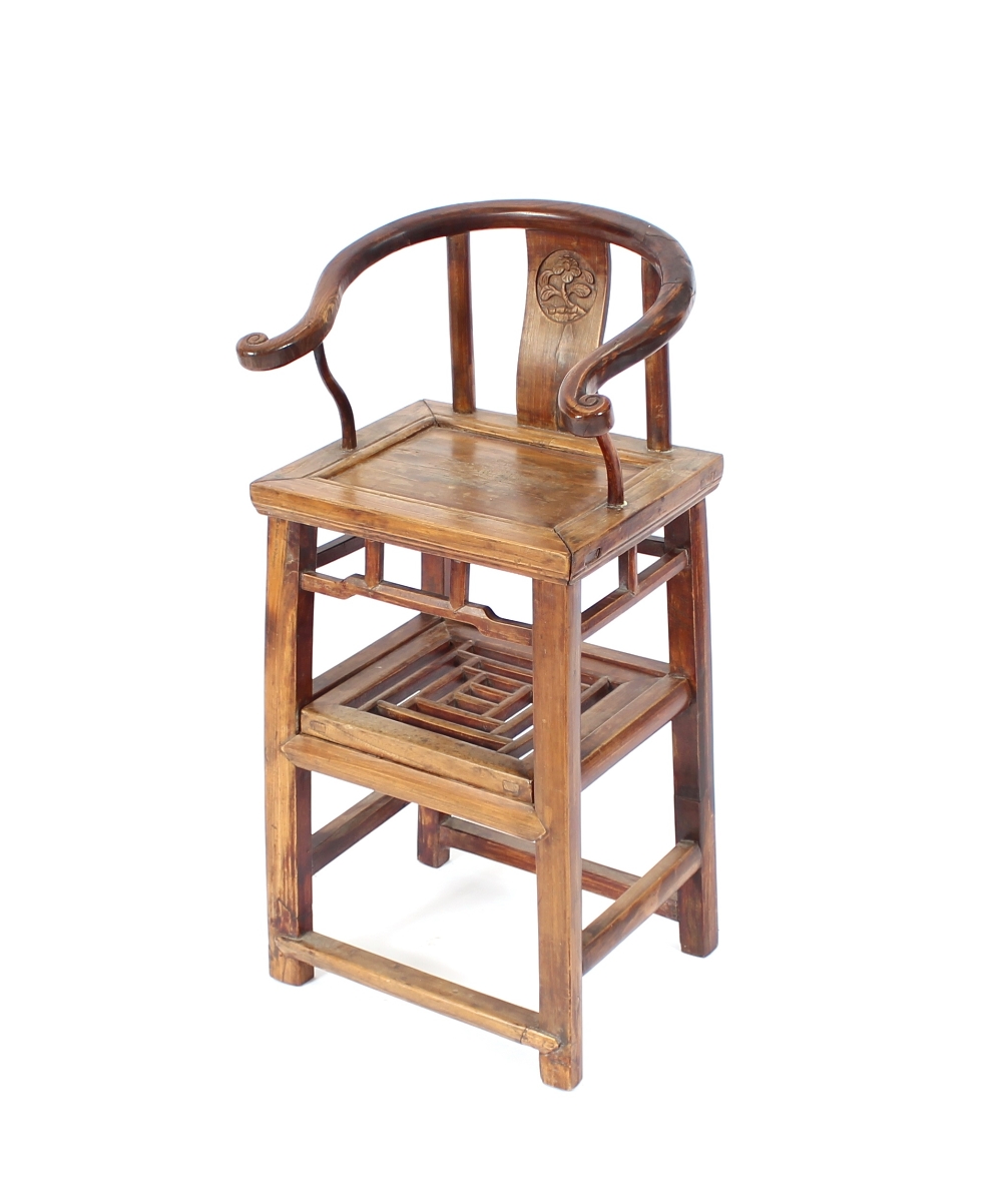 An Antique Chinese elm high chair, having curved and scrolled back rail, central splat with