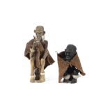 Two unusual South African ethnic carved wooden figures, one of a seated figure with sack-cloth