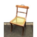 A pair of mahogany Trafalgar type dining chairs, having curved bar backs, rope twist centre rails,