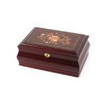 A decorative and inlaid musical jewellery box