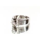 An 18 carat white gold and diamond set ring