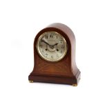 An Edwardian mahogany inlaid and chequer banded balloon cased mantel clock, circular steel dial