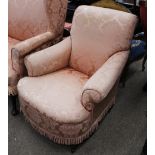 A late 19th Century Howard style deep seated armchair, upholstered in pink floral printed brocade