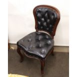 A set of four Victorian mahogany balloon back dining chairs, with buttoned leather upholstery,