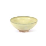 A Chinese cream glazed earthenware bowl, 18cm dia.
