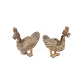 A pair of unusual decorative wooden grotesque bird ornaments, 35cm long x 39cm high