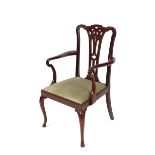 A set of eight mahogany Chippendale style dining chairs, having pierced splat backs, green dralon