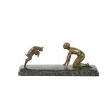 An Art Deco bronze figure group, depicting naked crouching lady and a lamb, signed Silvestre, on a