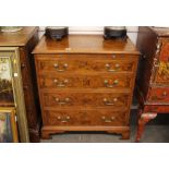 An 18th Century style walnut bachelor's chest, fitted brushing slide and four graduated drawers,