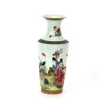 A Chinese porcelain cylindrical vase, decorated with figures in exotic landscapes, 30cm high