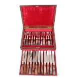 A cased set of 12 each agate handled fruit knives and forks, contained in a fitted mahogany case