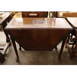 A Colonial carved mahogany drop leaf table, raised on rounded tapering supports and pad feet,