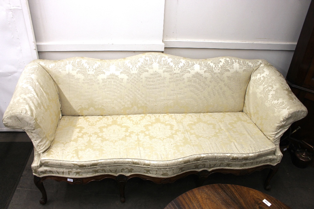 A large late 18th Century walnut framed sofa, having shaped back, upholstered in printed floral