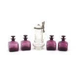 Four amethyst glass scent bottles, 10cm high; and a cut glass and pewter mounted flagon, probably