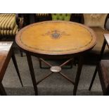 An Edwardian satinwood and mahogany cross-banded oval occasional table, in the Sheraton Revival