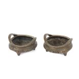 A pair of heavy Chinese bronze censers, having raised foliate decoration, seal marks to base, 18cm
