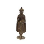 An oriental bronze deity figure, 20cm