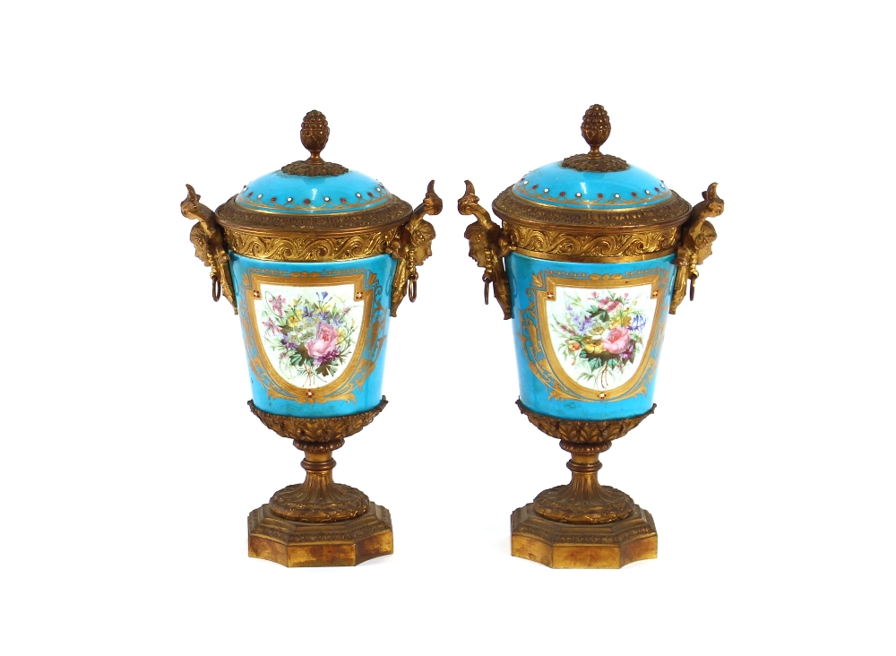 A pair of 19th Century Sevres style gilt metal mounted urns and covers, surmounted by foliate and - Image 2 of 19