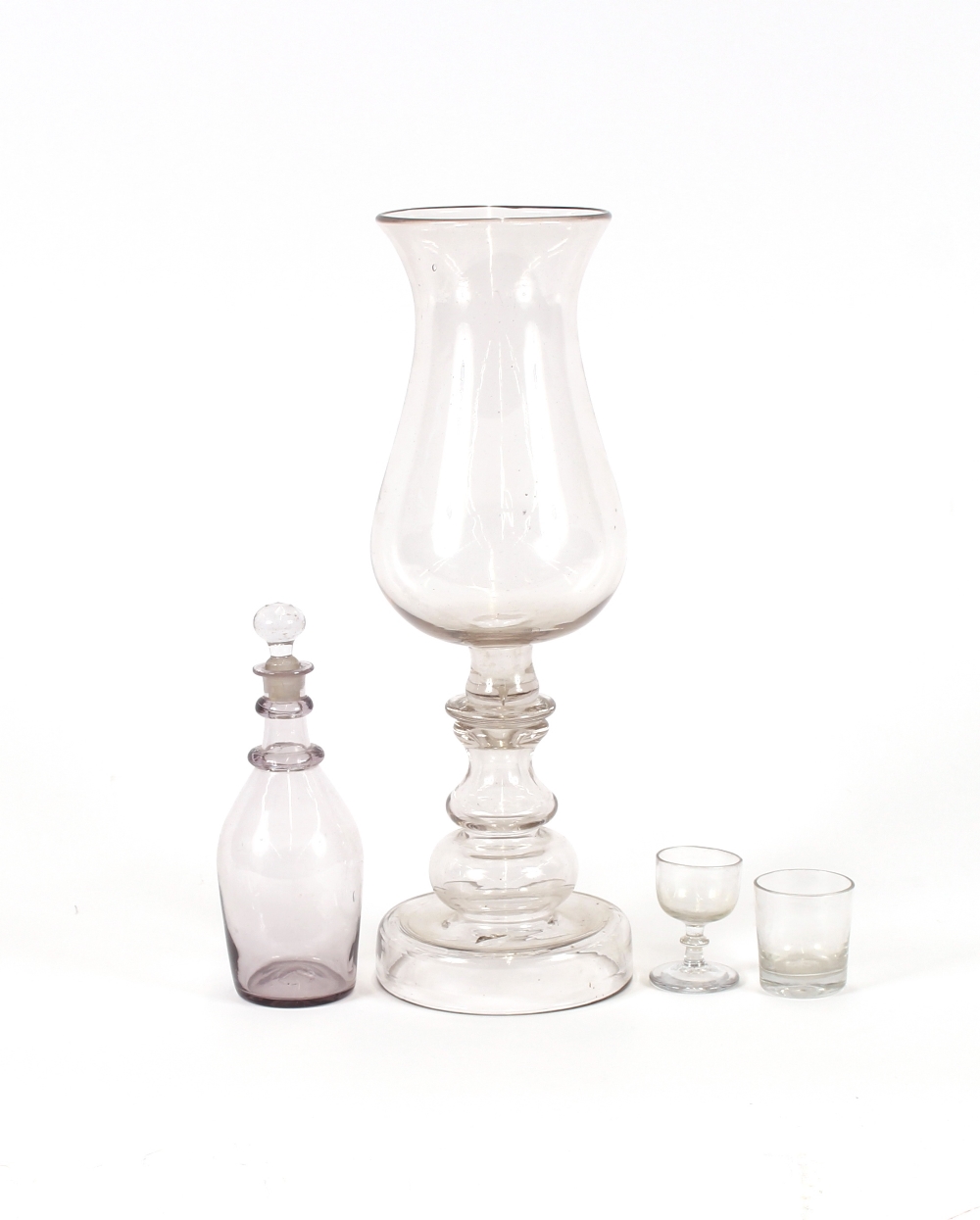 A Georgian glass baluster storm lamp, of large proportions, 41.5cm high; a small glass decanter