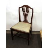 A set of six 19th Century mahogany Hepplewhite style dining chairs, with arched cresting, pierced
