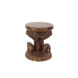 An ethnic carved elephant stool, 35cm dia. x 43cm high