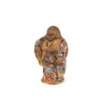 A glazed earthenware figure of Hotei, 28cm high
