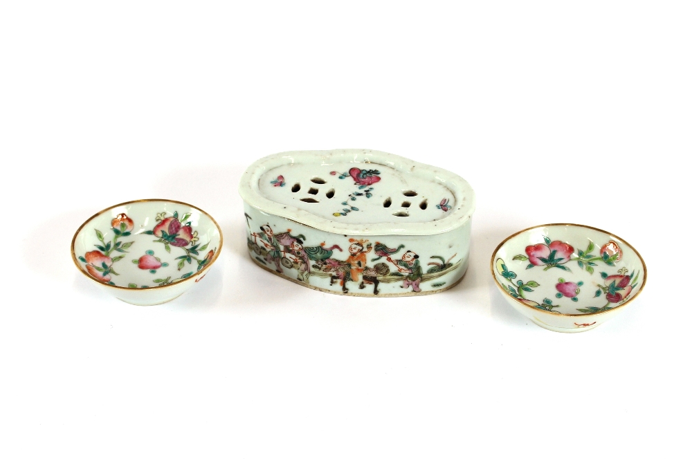 A Chinese porcelain cricket box, with pierced decoration and a pair of fruit decorated Chinese