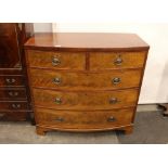 A 19th Century mahogany bow fronted chest, of two short and three long graduated drawers, raised