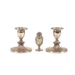 A small Victorian silver vase shaped pepperette, of fluted baluster form, London 1882; and a pair of