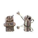 A 19th Century Continental white metal miniature watering can, 5.8cm long overall; and a 19th