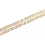 A 9 carat gold long guard chain, with fine twist and elongated links, approx. 27gms