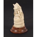 A carved ivory study of a Buddhist temple, 10cm high