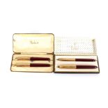 Four Parker gold and maroon pens, in two boxes