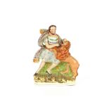 A Staffordshire flatback figure group, depicting Daniel and the lion, 26cm high